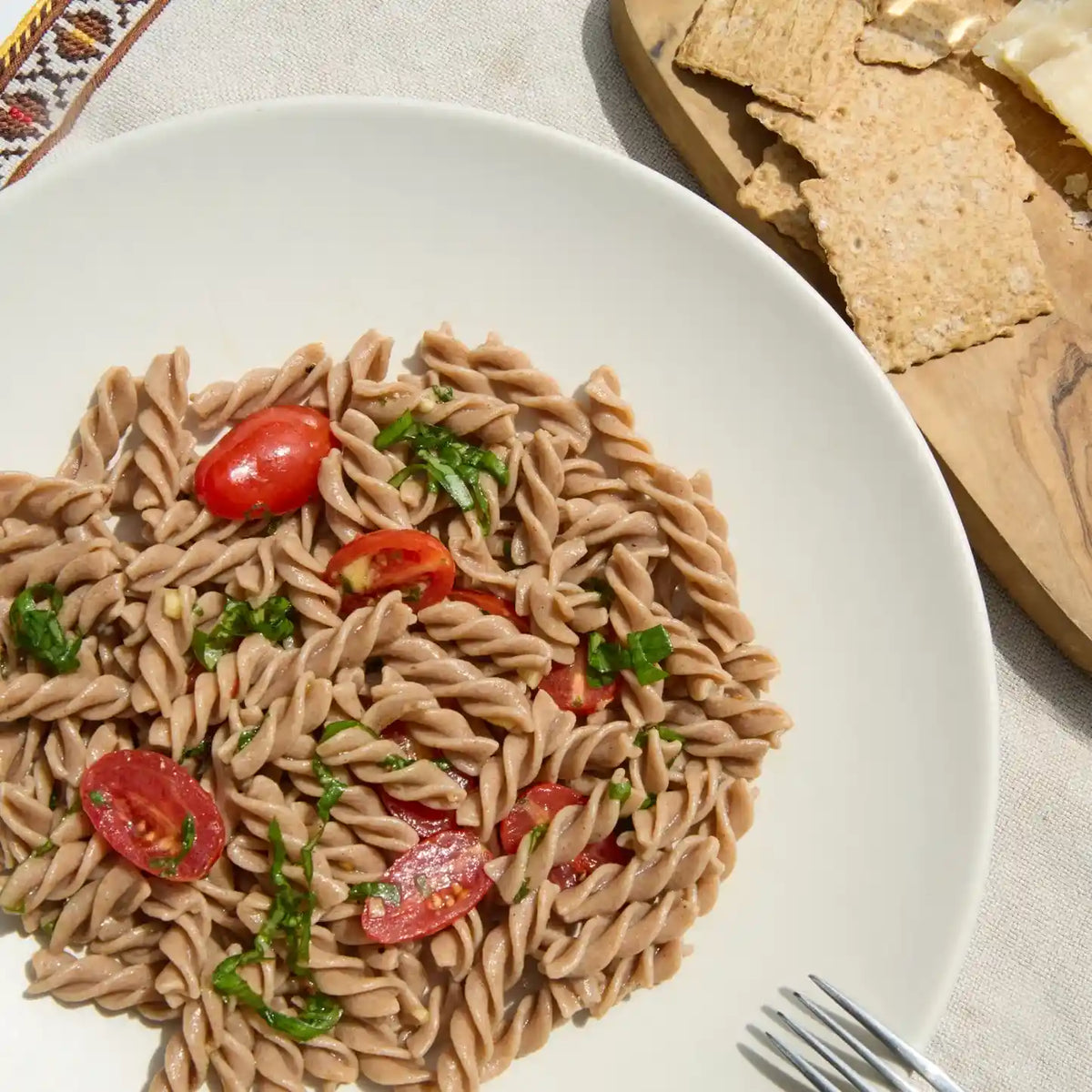 Plate of Organic Einkorn Fusilli with assorted ingredients
